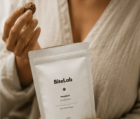 A person enjoying a BiteLab bite while holding the pouch